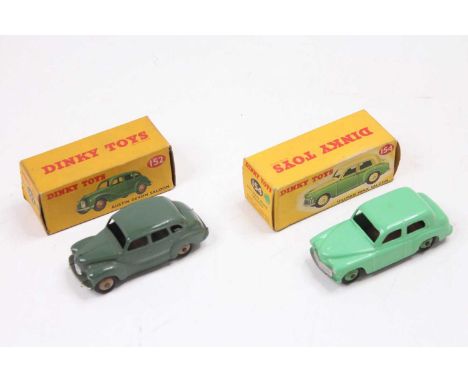 Dinky Toys pair of boxed cars to include, No. 152 Austin Devon Saloon finished in dark green with fawn ridged hubs - some mar