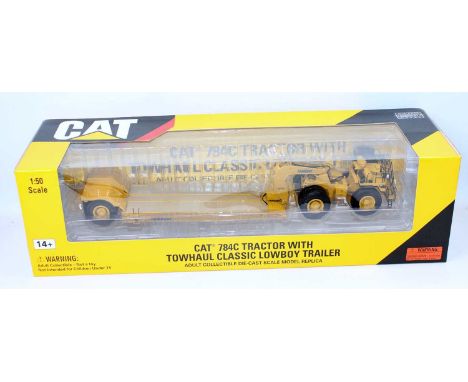 Norscot No.55220 1/50th scale diecast model of a Caterpillar 784C Tractor with Tow Haul Trailer, housed in the original windo