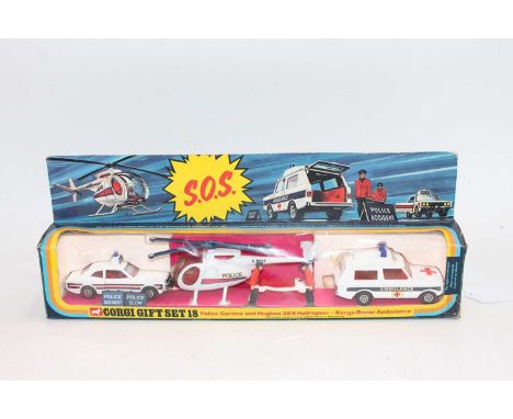 Corgi Toys Gift Set GS18 "SOS" containing Ford Cortina Police Car, Range Rover Ambulance and Hughes 369 Police Helicopter wit