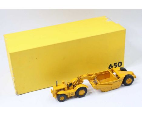 Black Rat Models 1/50th scale model of a Caterpillar 650 Scraper, housed in the original polystyrene packed box, box lid spli