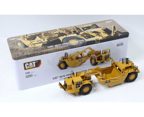 Diecast Replicas No.85175 1/50th scale diecast model of a Caterpillar CAT 657G Wheel Tractor Scraper, housed in the original 