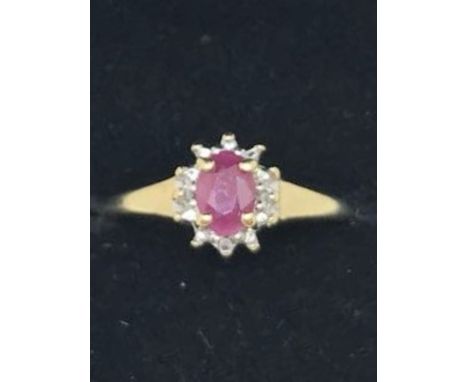 9ct gold ruby and diamond ring.  SZ  O