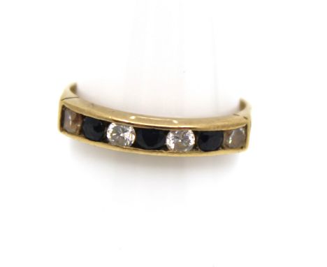 9ct Yellow Gold Sapphire and Cubic Zirconia Half Eternity Ring The ring contains three Round Brilliant Cut Sapphires that eac