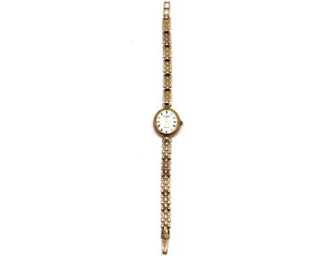 Ladies 9ct Gold Rotary Elite Watch with 9ct Gold Watch Bracelet  The Oval watch face measures approx. 2cm x 1.8cm including w