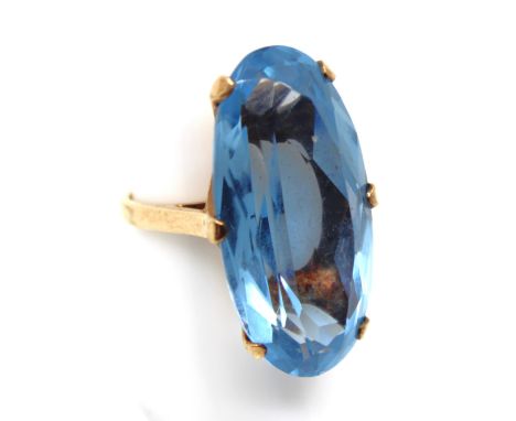9ct Gold Blue Gemstone Cocktail Ring  The ring contains an Oval Brilliant Cut Blue Gemstone that measures approx. 30mm x 15mm