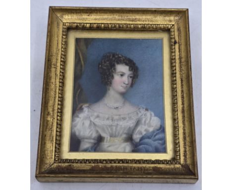 An early 19th Century Georgian Miniature Watercolour. Portrait of a Young Lady. (British School) Wearing a white dress with y