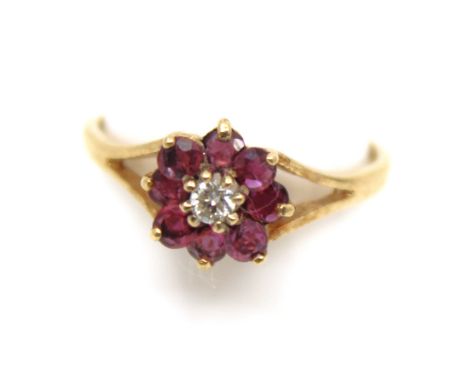 9ct Yellow Gold Pink Coloured Stones and Diamond Dress Ring  The ring contains an approx. 0.05ct Solitaire Round Brilliant Cu