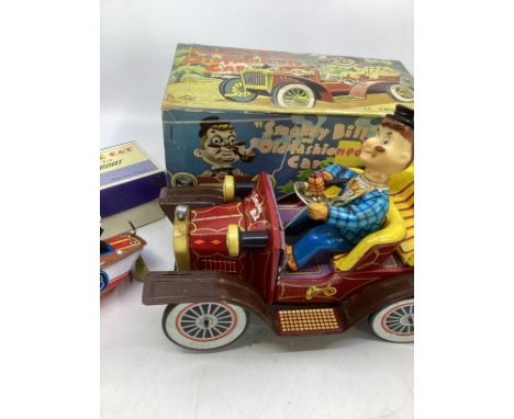    Vintage toy Smokey bill battery tin plate car , with pipe smoking figure in front( vinyl head removes for the box) battery