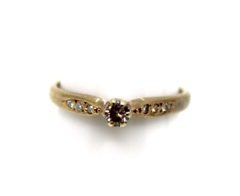 9ct Yellow Gold Approx. 0.15ct Solitaire Round Brilliant Cut Diamond Ring with Diamond Shoulders.  The ring contains an appro