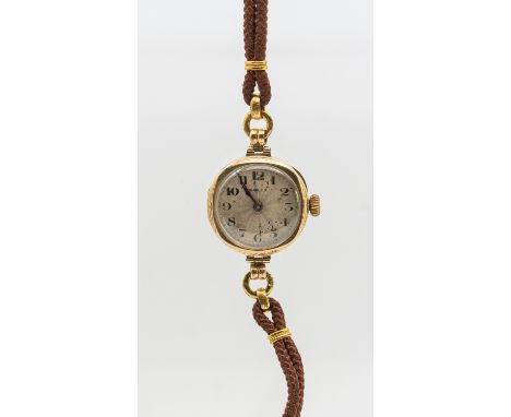 Ladies Vintage 9ct Gold Rolex Hand-winding watch with fabric strap.  The watch case is hallmarked "375" for 9ct Gold. On the 
