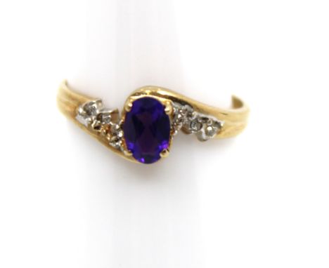 9ct Yellow Gold Amethyst and Diamond Ring  The ring contains an Oval Brilliant Cut Amethyst that measures approx. 6mm x 4mm. 