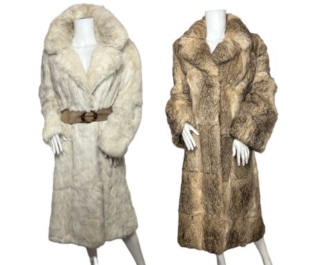 Two vintage coney fur coats, one in off white with a suede belt closure along with furrier hooks. The coat has two set in poc