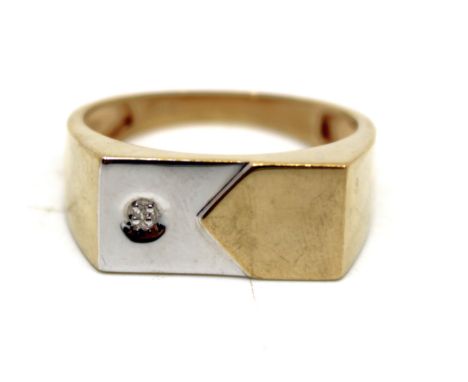 Men's 9ct Yellow and White Gold Single Diamond Signet Ring The ring contains an Illusion Set melee Round Brilliant Cut Diamon