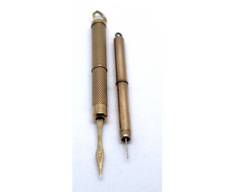 Two 9ct Gold Toothpicks.  The retractable toothpick with the engine turned pattern is hallmarked "375" for 9ct Gold, has the 