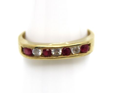 9ct Yellow Gold Ruby and Cubic Zirconia Half Eternity Ring  The ring contains four Round Brilliant Cut Rubies that each measu