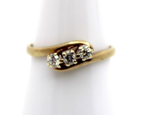 9ct Yellow Gold Three Stone Trilogy Diamond Ring The centre Round Brilliant Cut Diamond measures approx. 0.10ct and the side 