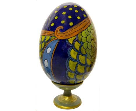 Ceramic egg hand painted with floral decorations. H Cm 33 with base.