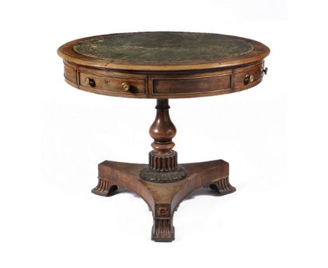 ϒA George IV rosewood drum table, circa 1825, the circular top with tooled inset leather writing surface, above four frieze d