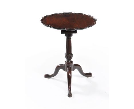 A George III mahogany 'pie-crust' tripod table, circa 1770, the circular shaped top with carved pie-crust edge above the bird