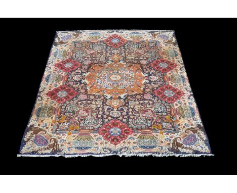 A Qum carpet, the polychrome field decorated with various foliate reserves and incorporating various Asian style motifs inclu