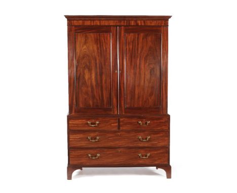 A George III mahogany clothes press, attributed to Gillows, circa 1800, the moulded cornice above a pair of cupboard doors op