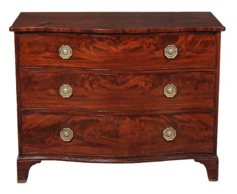 A George III mahogany serpentine fronted chest of drawers, circa 1800, the shaped top above three long graduated drawers, on 