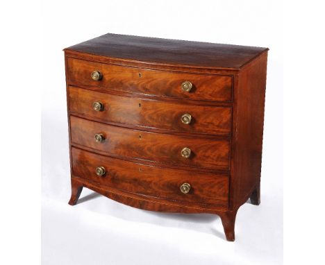 A George III mahogany chest of drawers, circa 1800, the shaped top with moulded edge, above four long graduated drawers and a