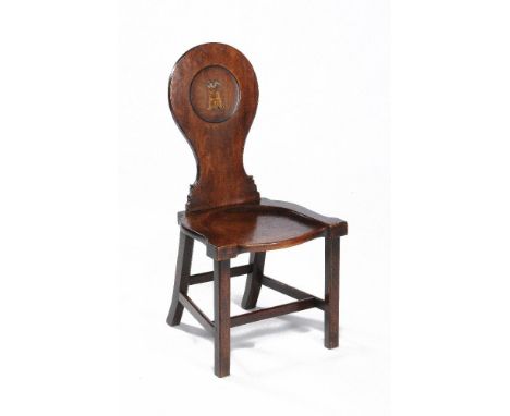 A George III mahogany hall chair, circa 1770, in the manner of Thomas Chippendale, the tapering back with moulded edge and sc