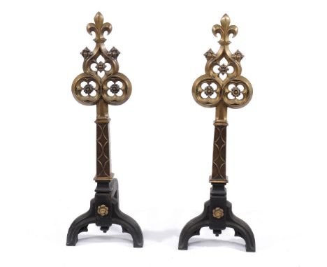 A pair of fine Victorian brass mounted cast iron andirons in Gothic style, mid 19th century, each with fleurs-de-lys finial a