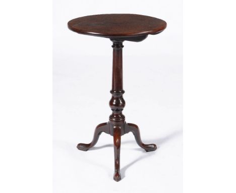 A George III mahogany tripod table, circa 1760, the circular tilt top above the turned stem and three outswept cabriole legs,