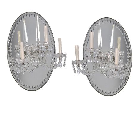 A pair of cut glass and silver plated three light girandoles in George III taste, 20th century, in the manner of examples by 