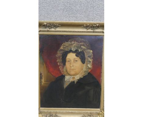 A carved gilt framed 19th century oil on canvas on board portrait of a Victorian woman in a  lace bonnet. Unsigned. H.80 W.70