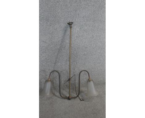 A vintage brass twin branch ceiling light with frosted bell shaped shades. H80cm 