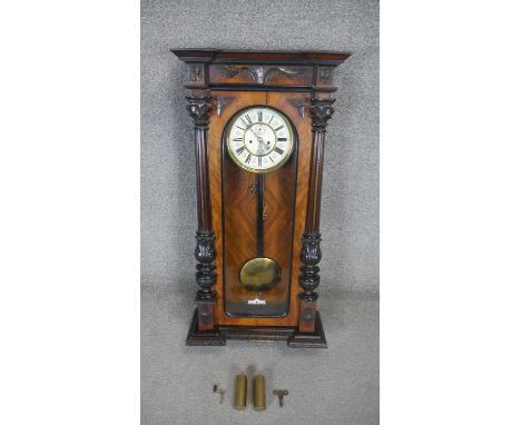 A 19th century walnut cased Vienna regulator with enamel dial and eight day movement. H91 W47 D20 