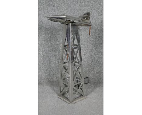 A vintage style chrome lamp in the form of a jet plane on a tower. W.20 D.20 H.66 