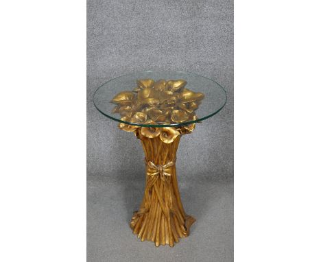 A glass topped lamp table with moulded gilt base in the form of a bunch of Calla Lillies. h66 w50 