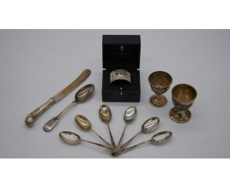 A collection of silver. Including a cased silver napking ring, hallmarked: Asprey &amp; Garrard, London, 1998, two egg cups o