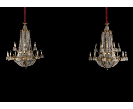 A large set of four gilt-brass and cut-glass tent and bag eighteen-light chandeliers20th century, in the 18th century styleFi