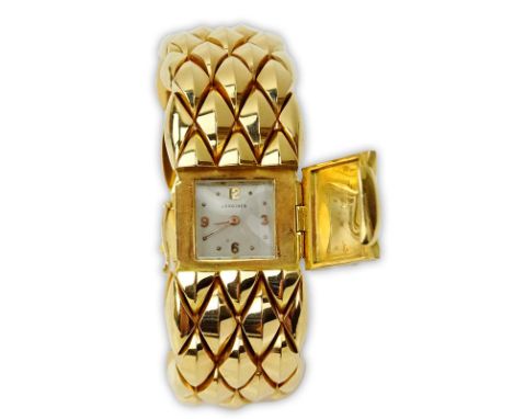Lady's Vintage Heavy 18 Karat Longines Manual Movement Bracelet Watch. Stamped 750. Good vintage condition. Appears to be run