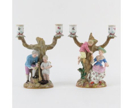 Pair of 19th Century Meissen Two Arm Porcelain Figural Candelabras. Blue crossed swords mark on underside, one stick has an i