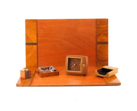 Six (6) Pieces Gucci Desk Accessories. Includes: Ashtray, lighter, leather cased clock, note paper holder and 2 desk blotters