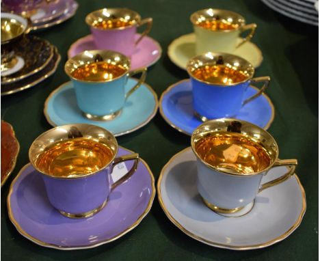 A Collection of Six Czechoslovakian Harlequin Coffee Cans and Saucers 