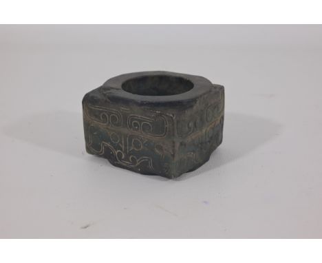 A Chinese archaistic black and green jade Cong, H. 5 cm, W. 7 cmCondition: natural crack and inclusion, otherwise in good con