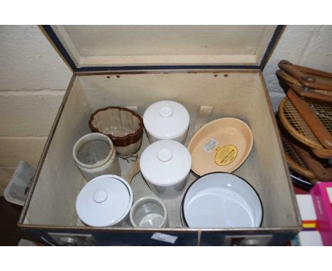 Vintage suitcase with White State Line labels containing various assorted kitchen wares