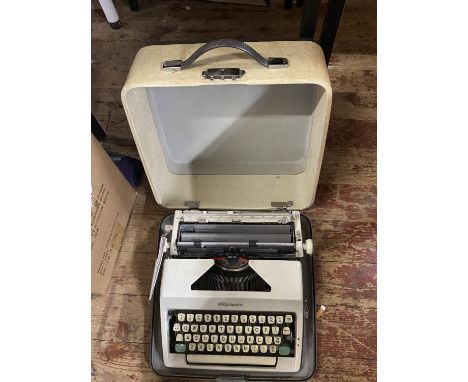 A vintage Olympia portable typewriter, shipping unavailable 