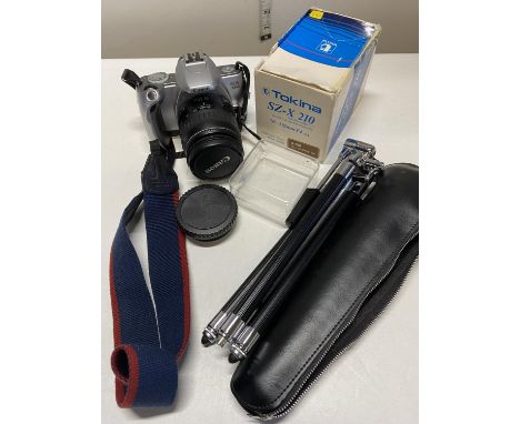 A Canon EOS 300 camera and a selection of camera accessories (untested) 
