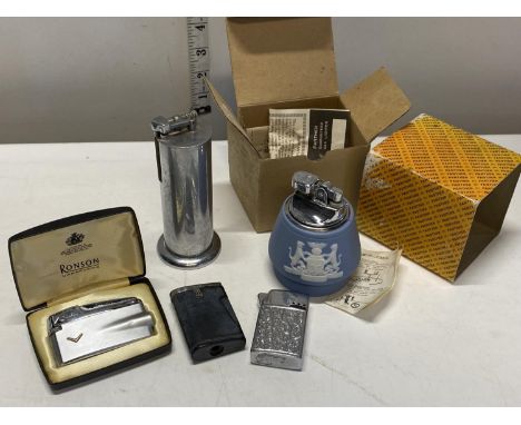 A selection of vintage lighters including Ronson and Panther. 
