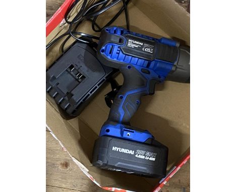 A Hyundai cordless impact wrench in working order with charger 