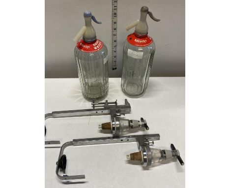 Two vintage soda syphons and two optics 