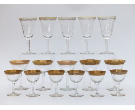 Seventeen Moser drinking glasses, all with floral decoration to the gilt rims and gilt feet, comprising six large wine glasse